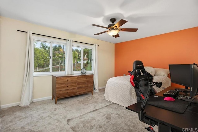 bedroom with carpet, a ceiling fan, and baseboards