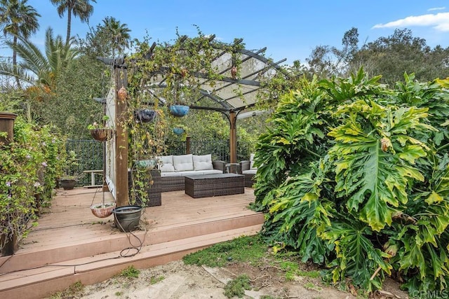 deck featuring an outdoor living space and a pergola