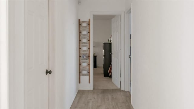 corridor with light wood-style floors