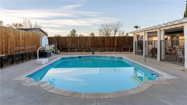 view of swimming pool with a patio area, a fenced backyard, and a fenced in pool