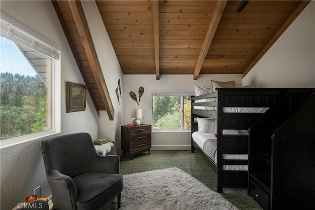 bedroom with vaulted ceiling with beams, wooden ceiling, carpet flooring, and baseboards