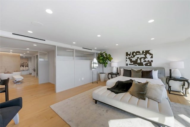 bedroom featuring visible vents, light wood-style flooring, and recessed lighting