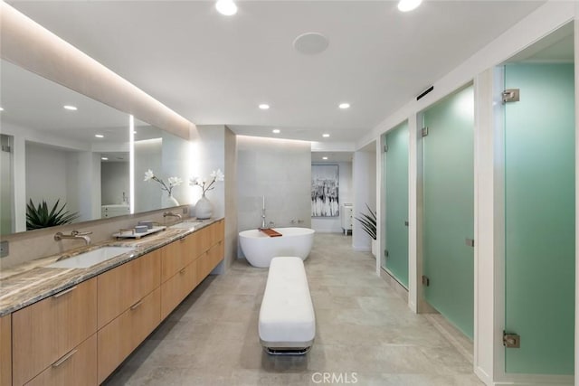 1310 E Ocean Blvd Unit 14, Long Beach, CA 90802 - bathroom featuring double vanity, a freestanding tub, recessed lighting, and a shower stall
