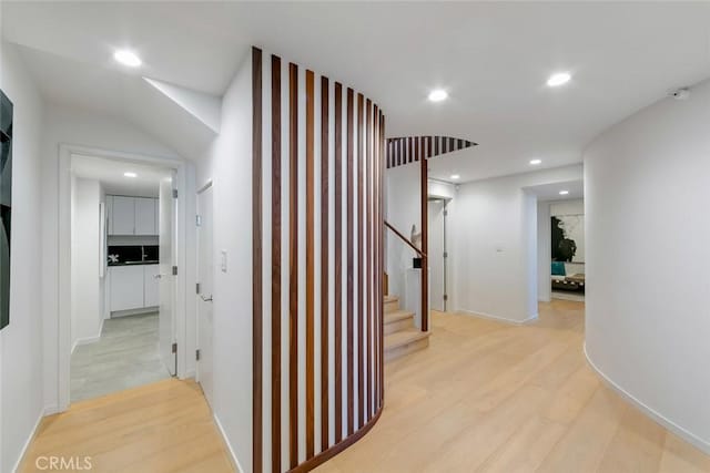 hall featuring stairs, recessed lighting, and light wood-type flooring