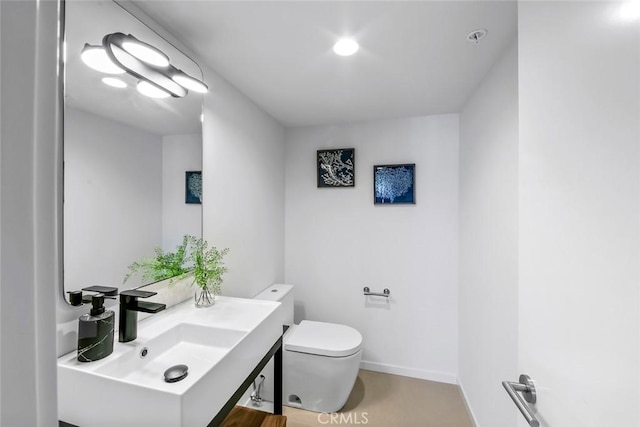 1310 E Ocean Blvd Unit 14, Long Beach, CA 90802 - half bathroom featuring toilet and vanity