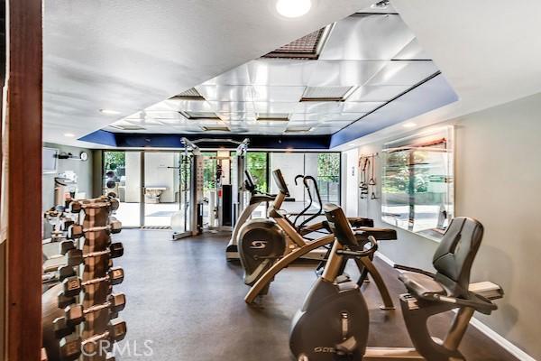 gym featuring baseboards