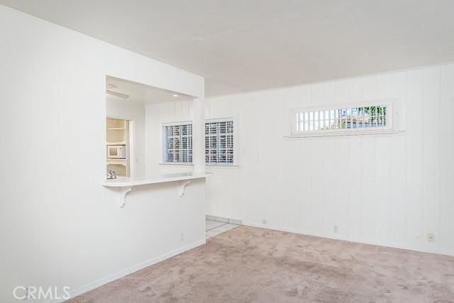 empty room featuring carpet flooring