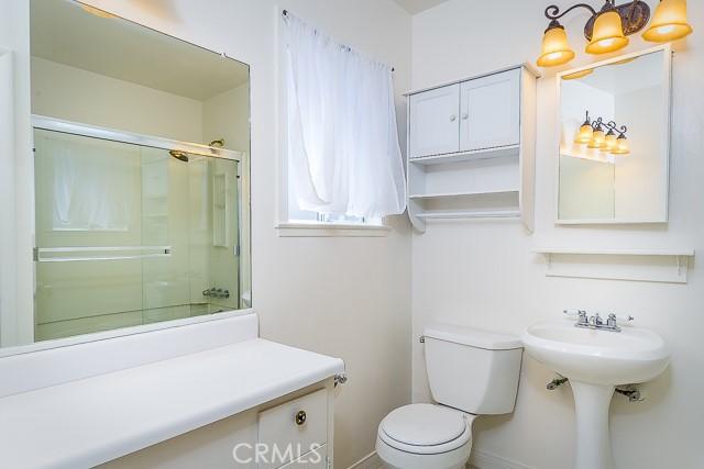 full bath featuring an enclosed shower and toilet