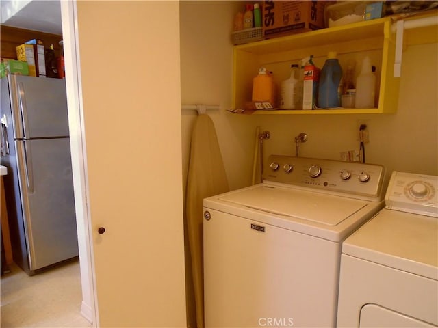 laundry area with laundry area and separate washer and dryer