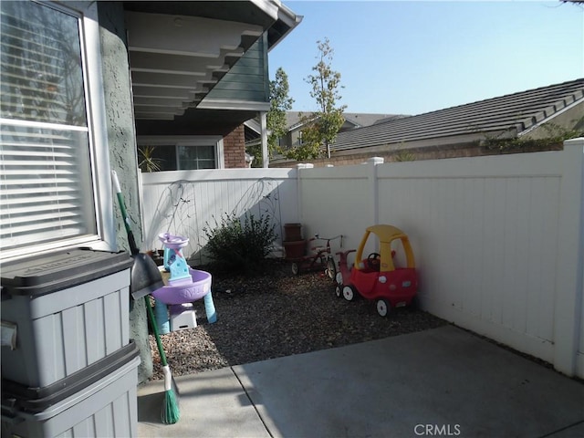 view of patio / terrace featuring fence