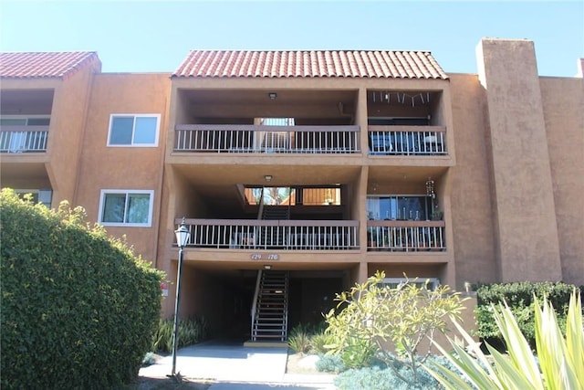 6600 Warner Ave Unit 142, Huntington Beach, CA 92647 - view of apartment building / complex with stairs