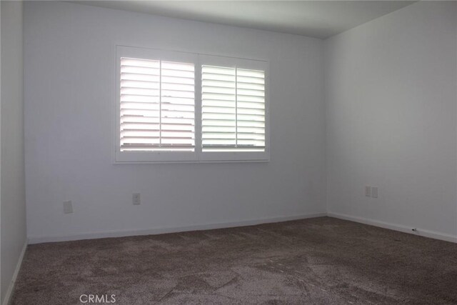 6600 Warner Ave Unit 142, Huntington Beach, CA 92647 - unfurnished room featuring carpet flooring and baseboards