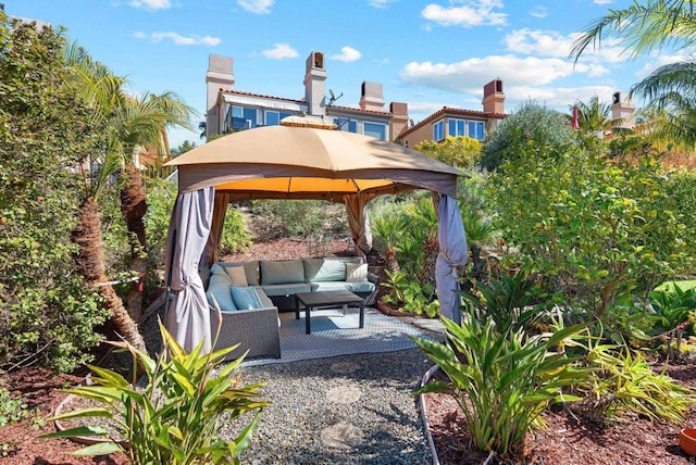 view of patio featuring an outdoor living space and a gazebo