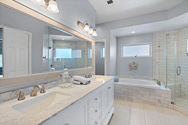 full bath with visible vents, a sink, a shower stall, and a bath