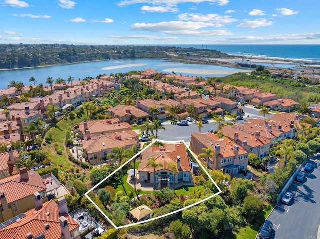 bird's eye view with a water view and a residential view