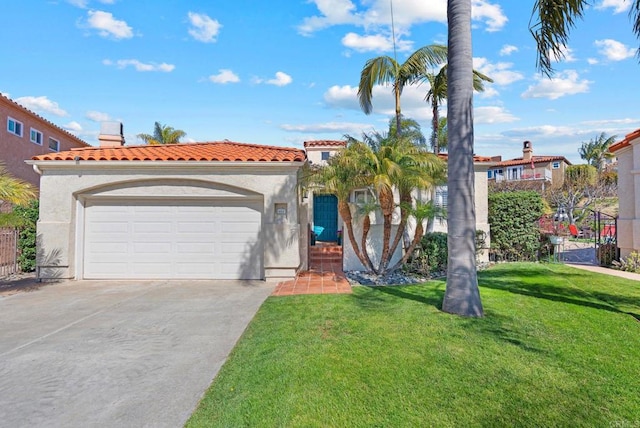 mediterranean / spanish house with stucco siding, concrete driveway, a garage, a tiled roof, and a front lawn