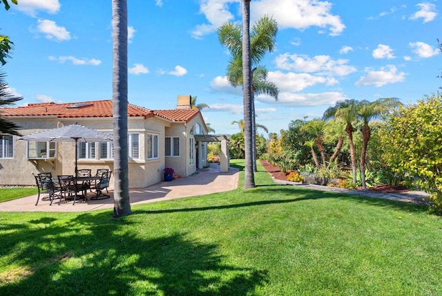 view of yard with a patio area and a pergola