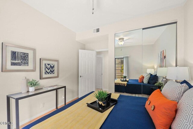 bedroom featuring baseboards, visible vents, and a closet