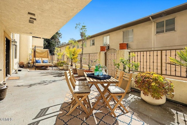 view of patio / terrace featuring fence