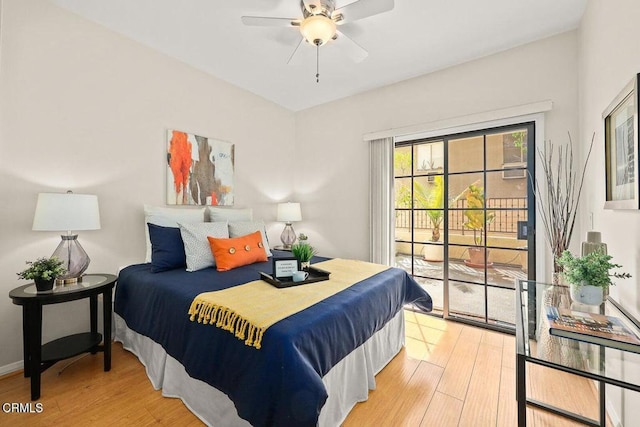 bedroom with access to exterior and light wood-style flooring