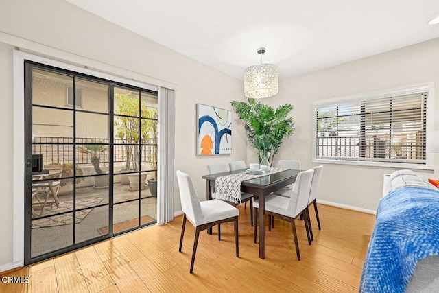 dining area featuring wood finished floors and baseboards