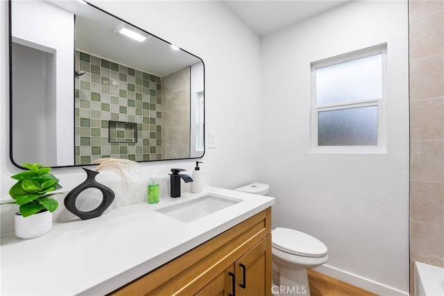 bathroom with a shower, a tub to relax in, toilet, vanity, and baseboards