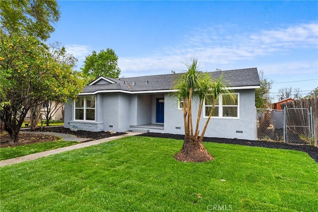 view of front of property with fence, roof with shingles, crawl space, stucco siding, and a front lawn