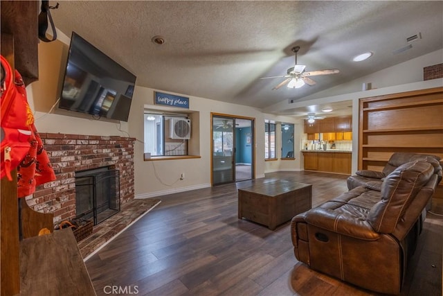 19200 Haida Rd, Apple Valley, CA 92307 - living area with dark wood-type flooring, lofted ceiling, a fireplace, and a textured ceiling