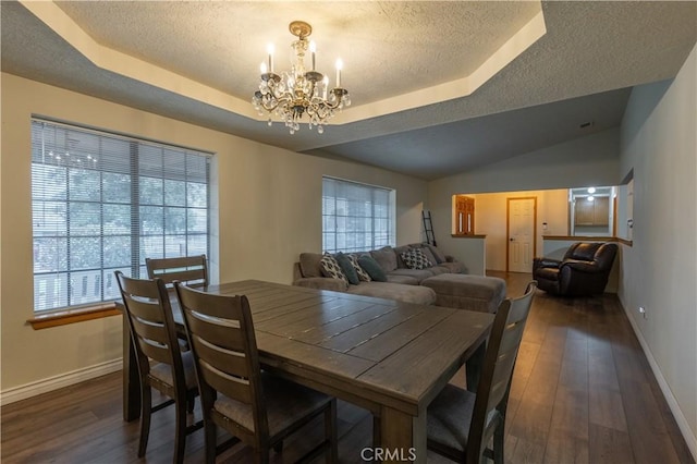 19200 Haida Rd, Apple Valley, CA 92307 - dining room with dark wood-style flooring, a notable chandelier, a raised ceiling, a textured ceiling, and baseboards