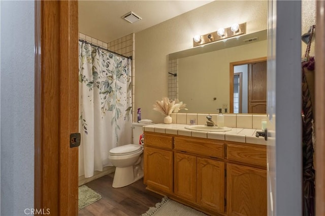 19200 Haida Rd, Apple Valley, CA 92307 - full bath with toilet, wood finished floors, visible vents, vanity, and a shower with curtain