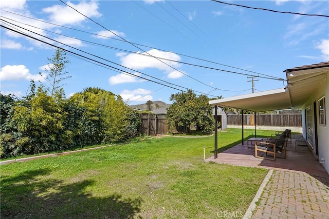 view of yard with a fenced backyard and a patio