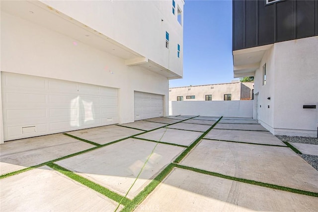 view of property exterior featuring a garage and stucco siding