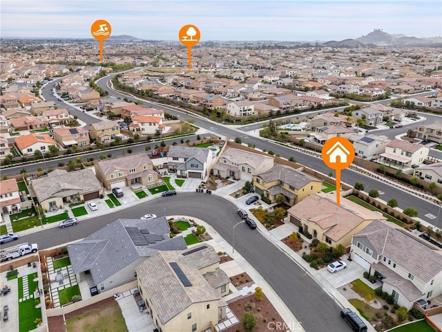 drone / aerial view featuring a residential view and a mountain view