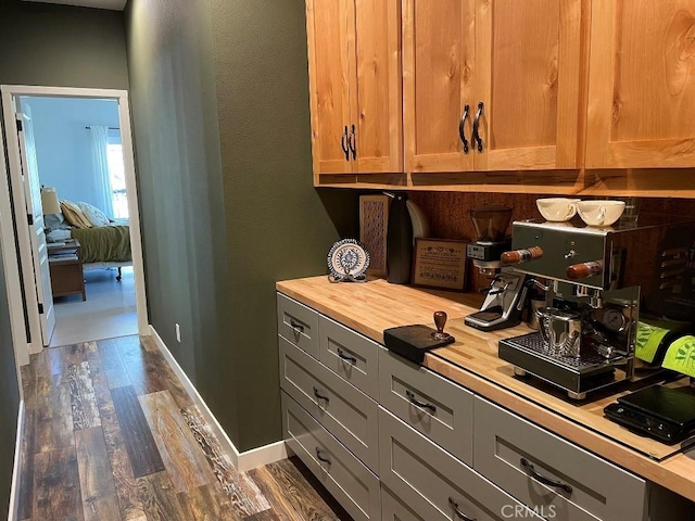 office space featuring dark wood finished floors and baseboards