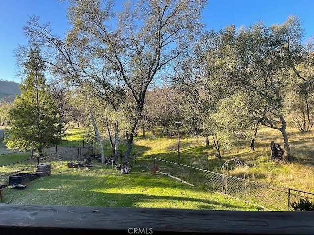 view of yard with fence and cooling unit