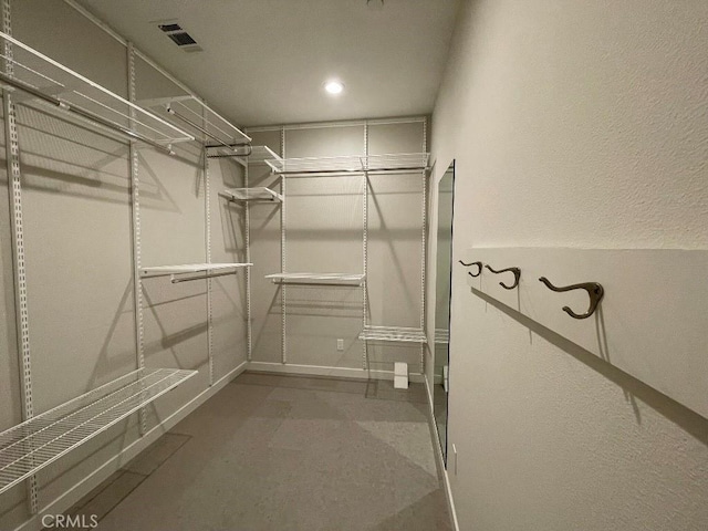 walk in closet with visible vents