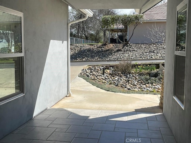 view of patio / terrace featuring fence