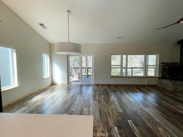 unfurnished living room with high vaulted ceiling, visible vents, and wood finished floors