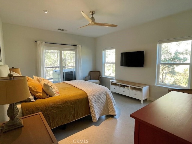 bedroom featuring access to outside, visible vents, and a ceiling fan