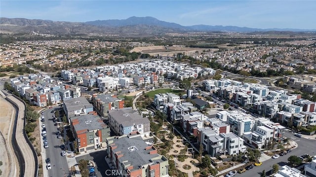 birds eye view of property featuring a mountain view