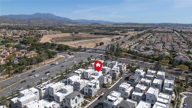 bird's eye view featuring a residential view and a mountain view