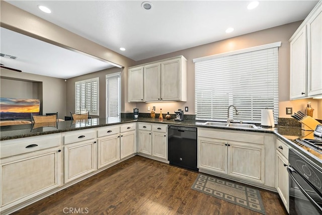 kitchen with visible vents, dark wood-style flooring, black appliances, a sink, and recessed lighting