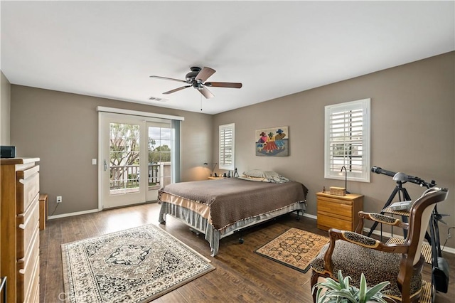 bedroom featuring access to outside, multiple windows, visible vents, and wood finished floors