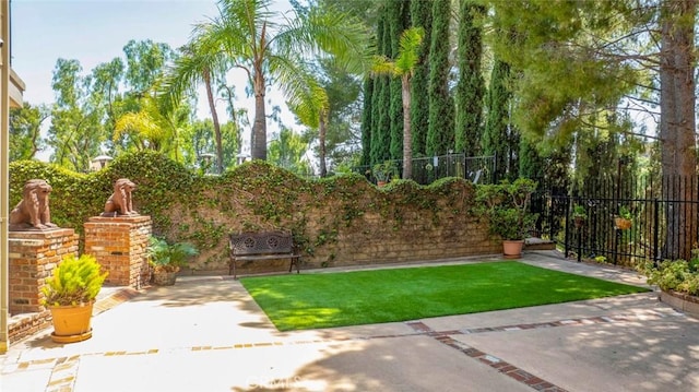 view of yard featuring a patio area and fence