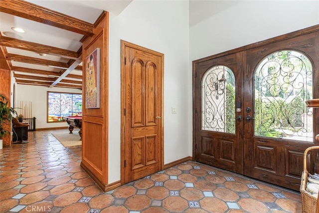 entryway featuring french doors, coffered ceiling, beam ceiling, and baseboards