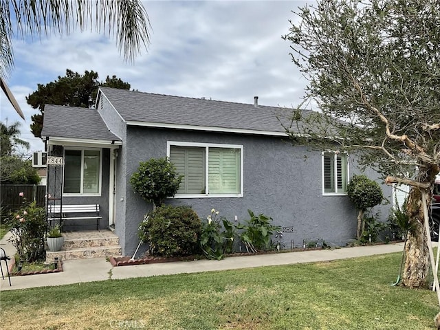 7844 Gainford St, Downey, CA 90240 - ranch-style house with stucco siding, a front yard, and roof with shingles