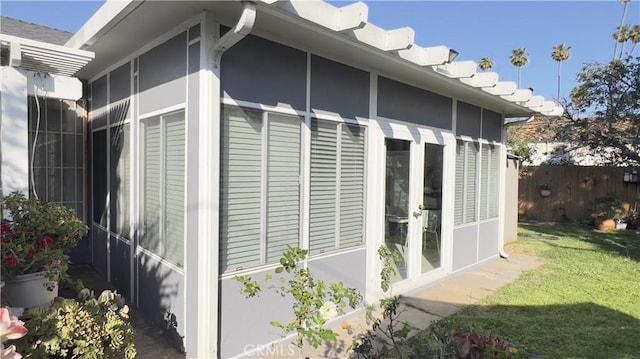 7844 Gainford St, Downey, CA 90240 - view of side of home with stucco siding and a sunroom