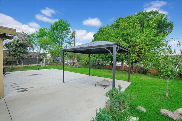 view of patio featuring fence private yard and a gazebo