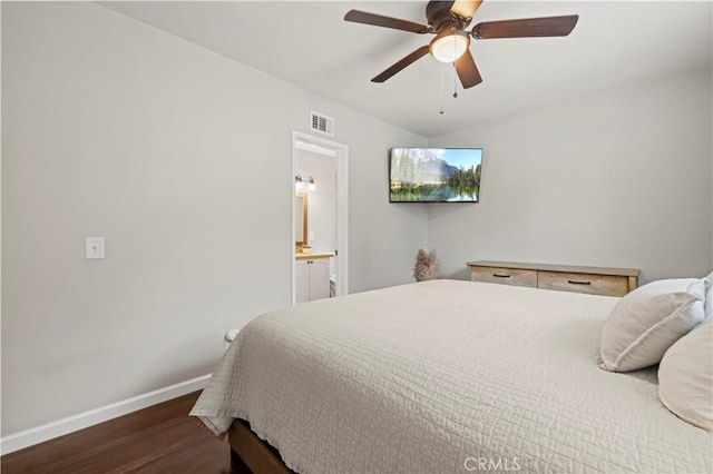 bedroom with visible vents, a ceiling fan, wood finished floors, connected bathroom, and baseboards