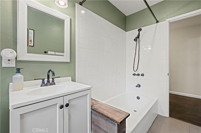 full bathroom with tile patterned flooring, vanity, bathing tub / shower combination, and baseboards